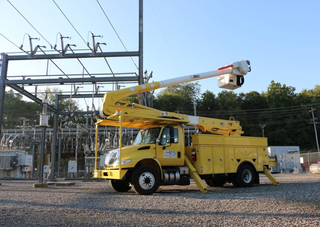 hopkinsville electric system (hes) bucket truck sitting in front of utility lines and power sources